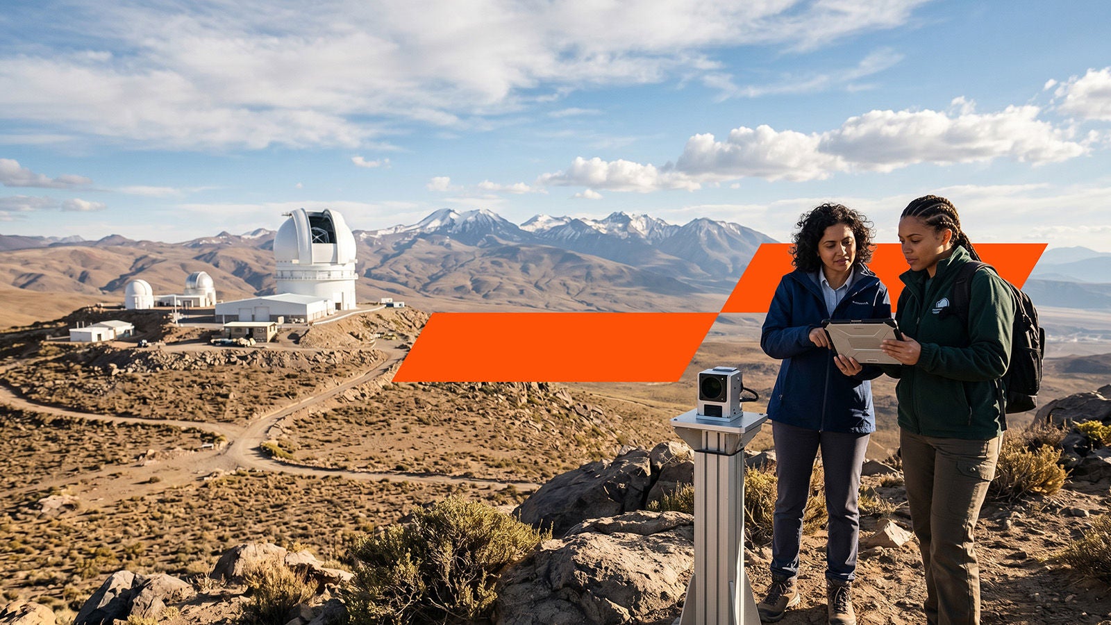Two female colleagues working outside at an observatory