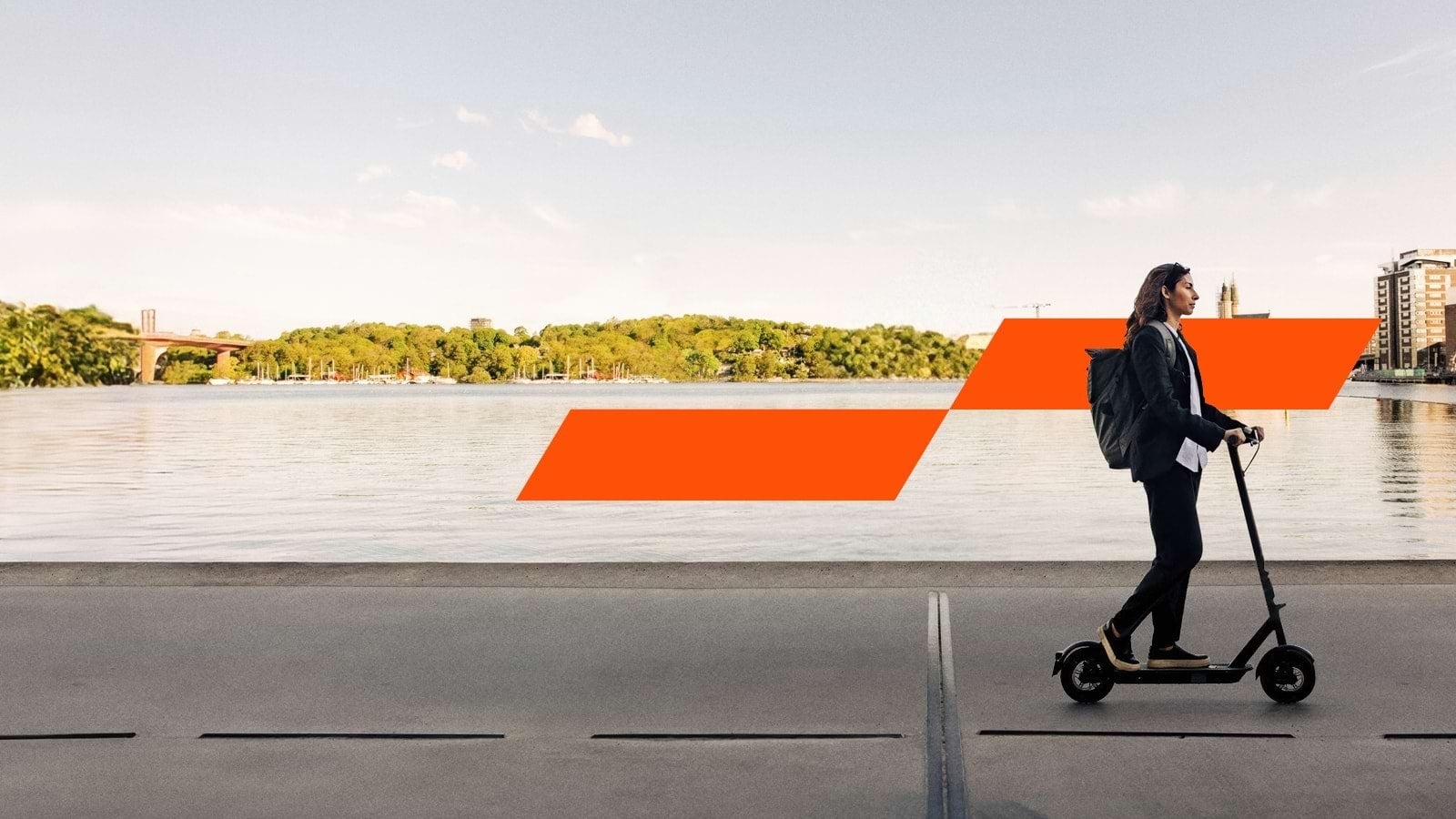 A woman riding an electric scooter