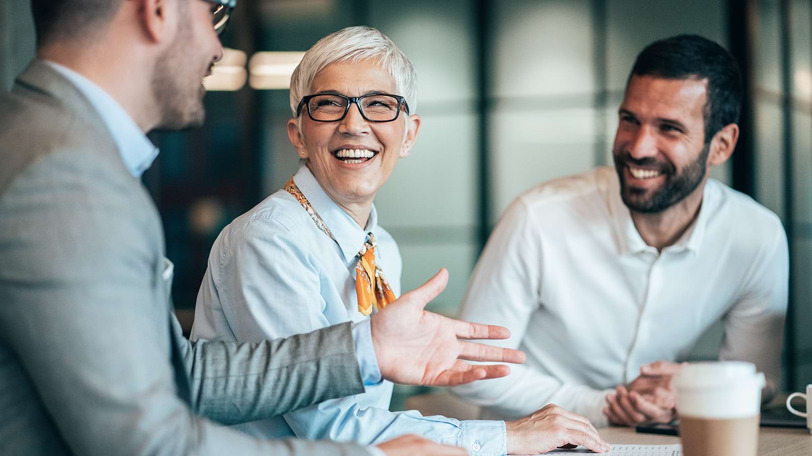 Modern business people talking in coffee break in the office